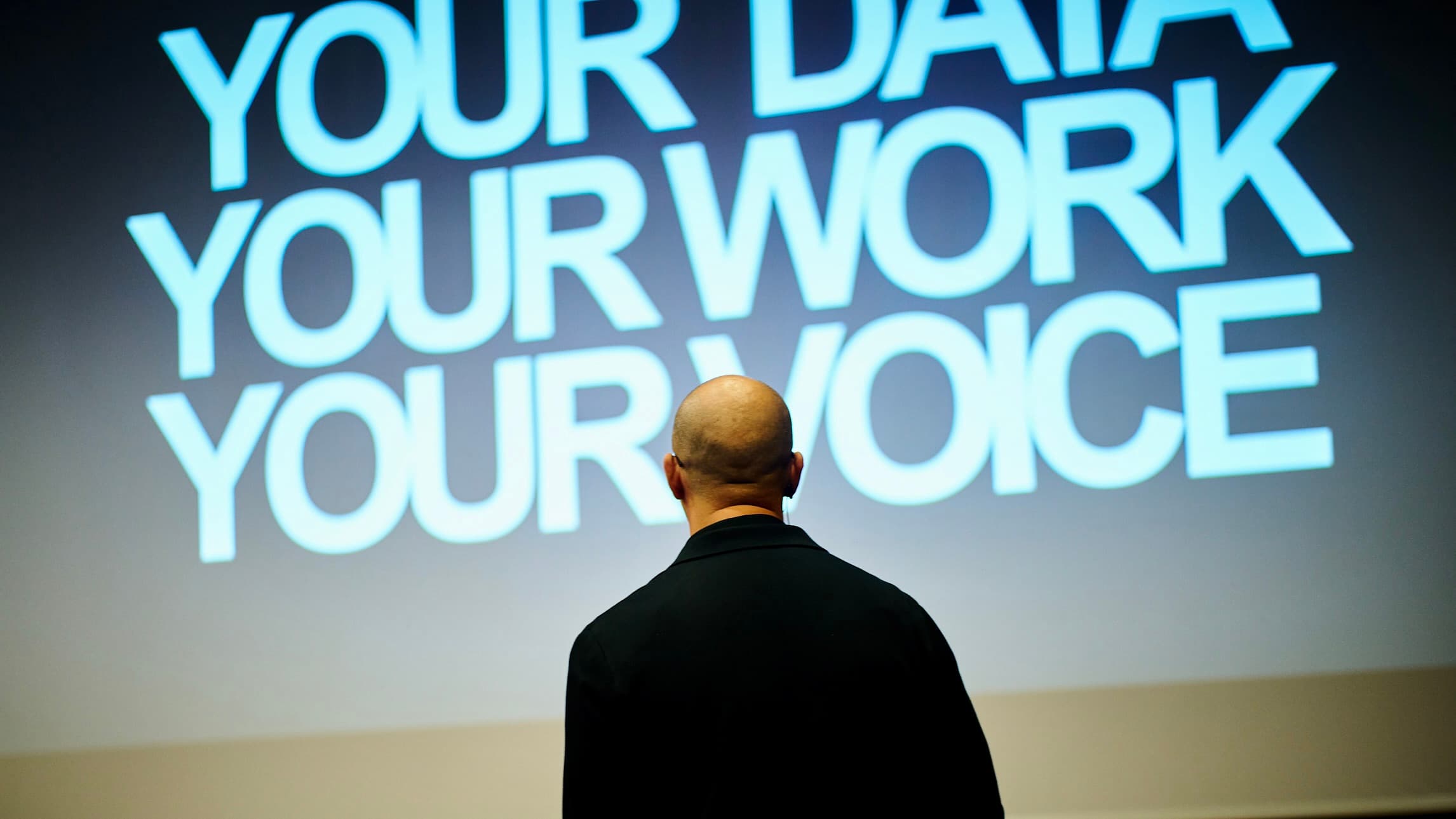 James Poulter speaking on stage